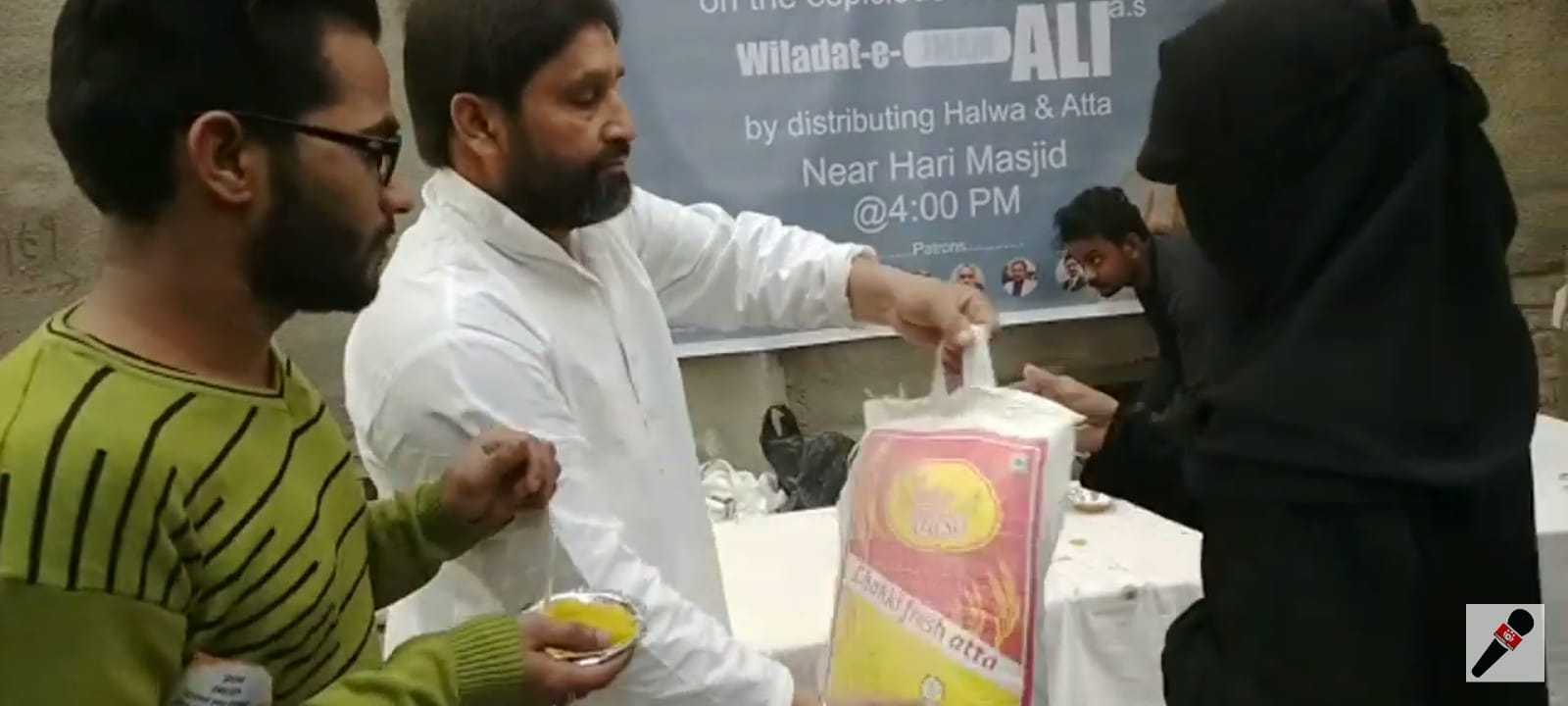 Distributing Halwa and Atta